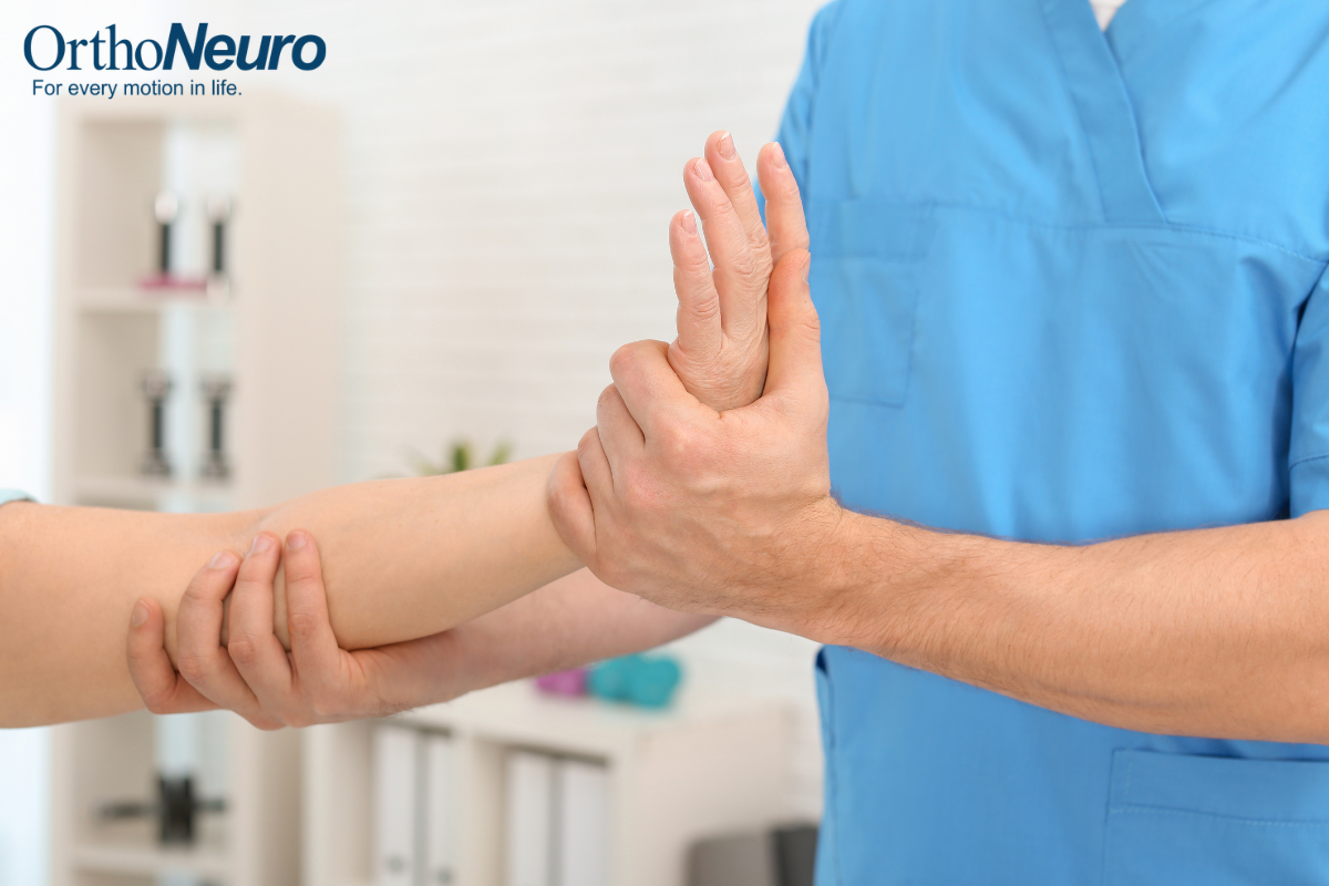 A physical therapist treating a patient with a wrist injury in Ohio.
